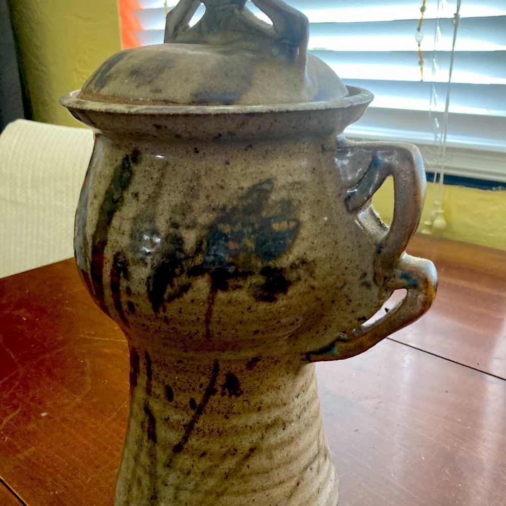 And artistic pottery container!  Could be used as a vase, picture, or artwork